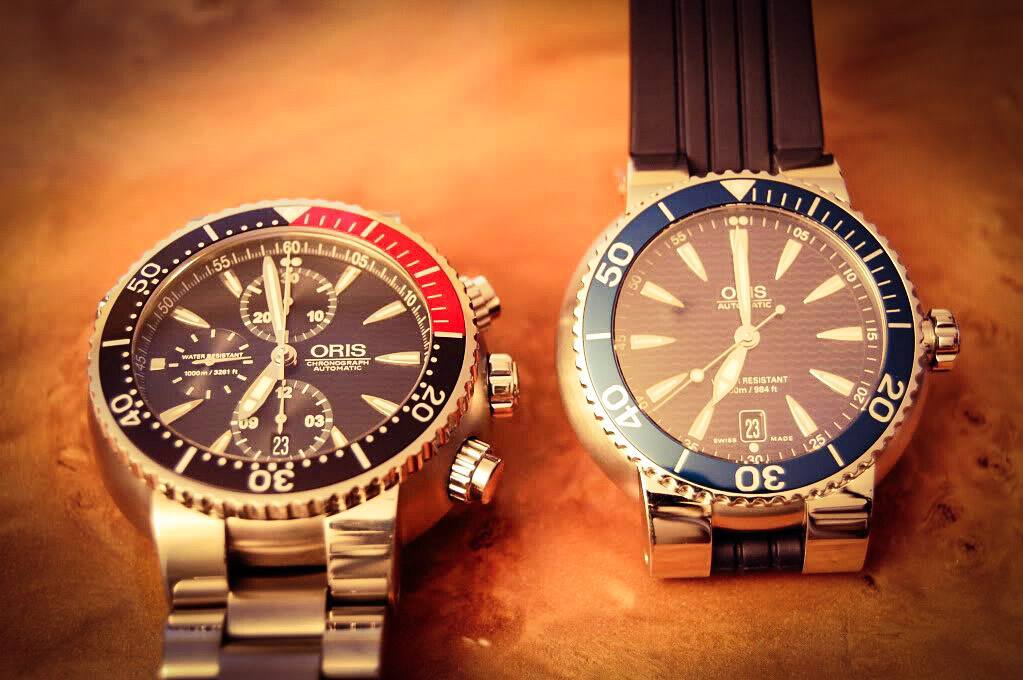 康卡斯和豪利时潜水表哪个好,绿水鬼掰手腕