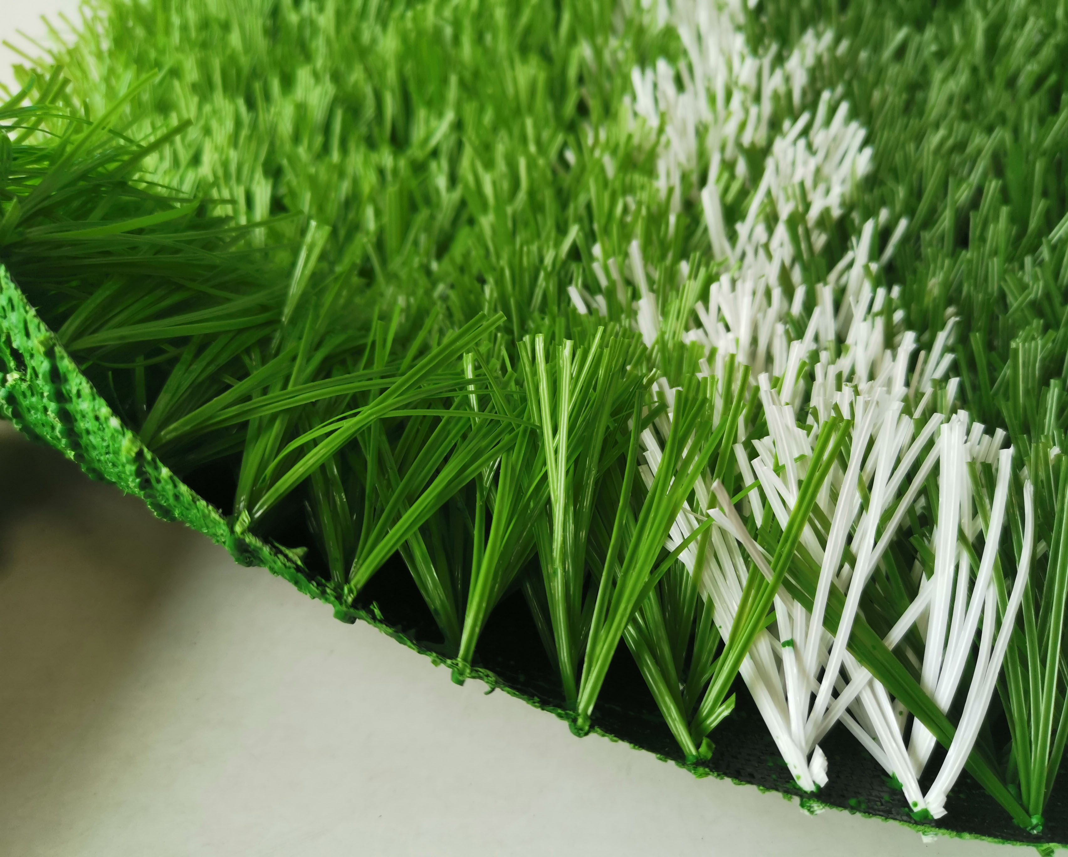 足球场假草坪多少钱一个平方,50mm足球场假草坪多少钱一平米